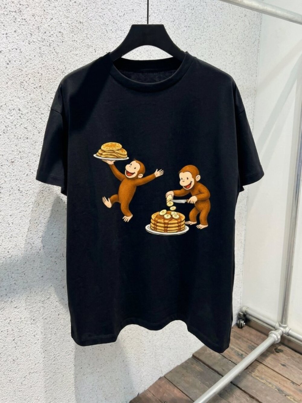 Curious George Peeling a Banana Modern Cartoon with Logo Toddler T-shirt